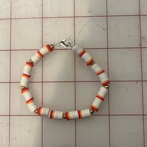 White, orange, and red clay bracelet